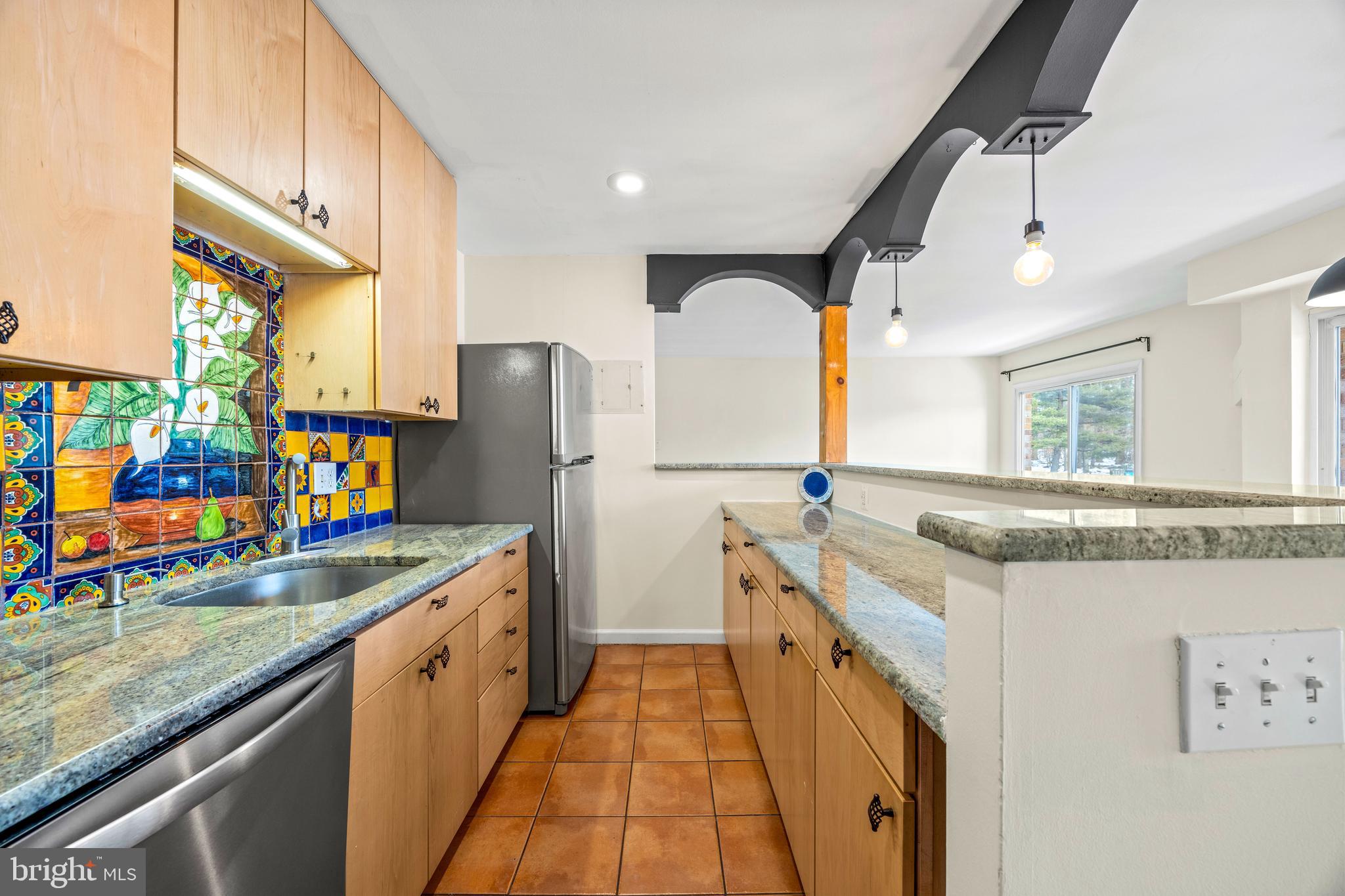 3736 Bel Pre Road, Unit 37367 Silver Spring, MD 20906 - Photo 7 of 27 a kitchen with stainless steel appliances granite countertop a sink and a refrigerator