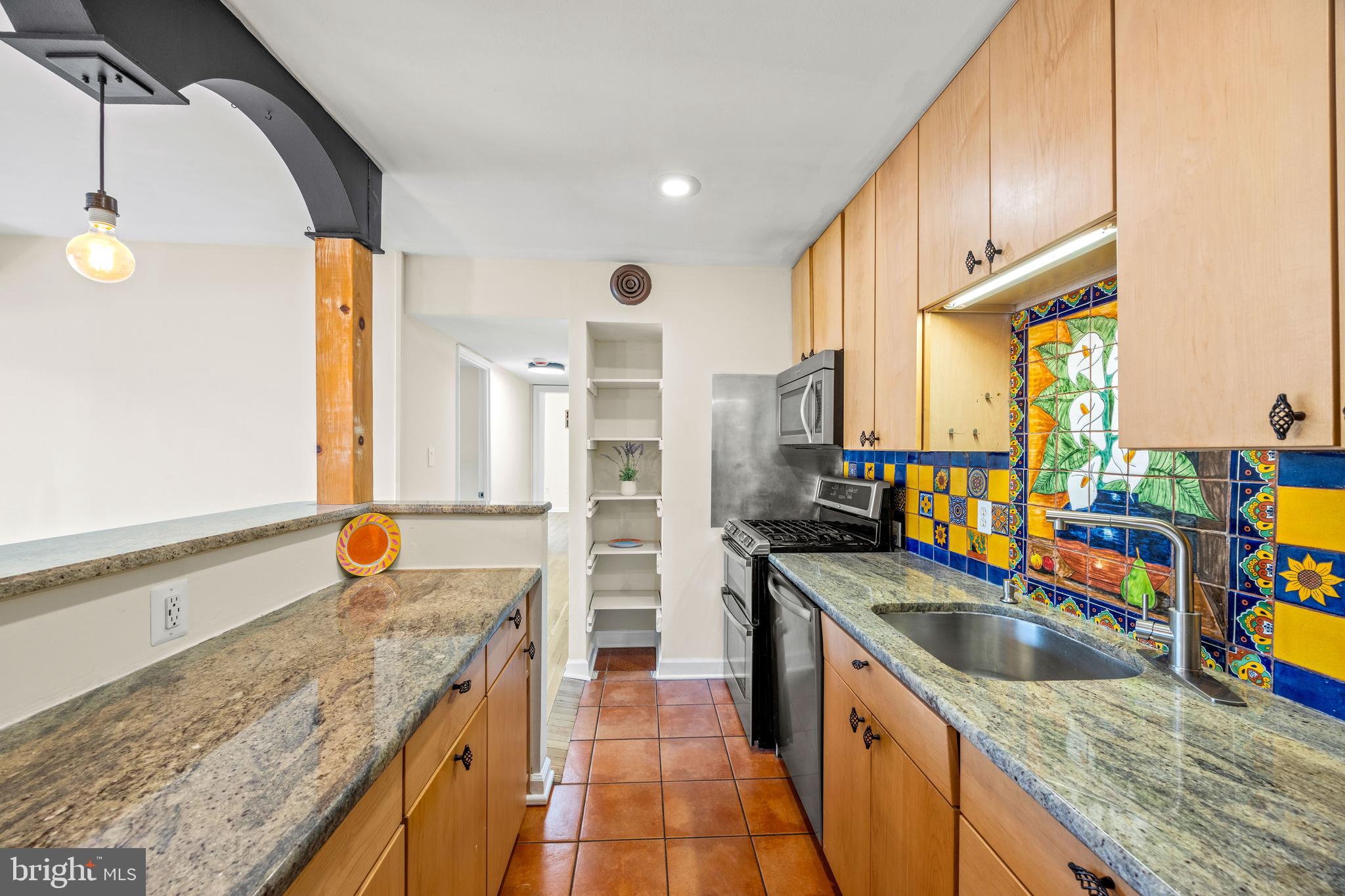 3736 Bel Pre Road, Unit 37367 Silver Spring, MD 20906 - Photo 10 of 27 a kitchen with stainless steel appliances granite countertop a sink a stove and a wooden floors