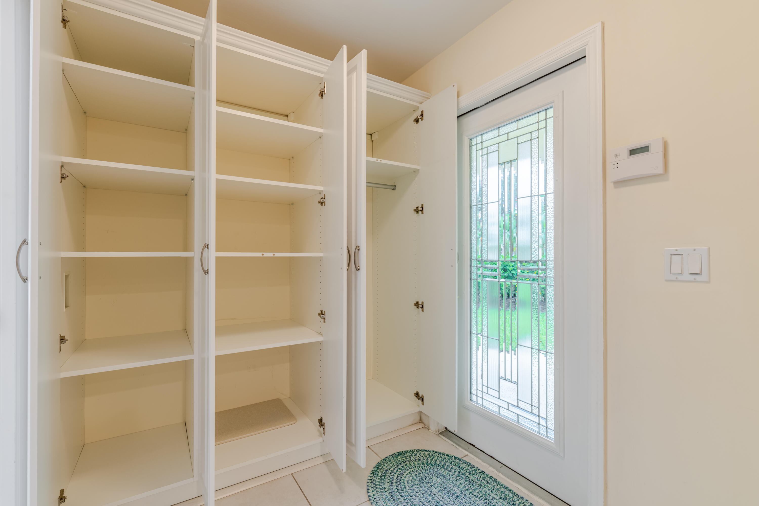 114 Beach Summit Court Jupiter, FL 33477 - Photo 16 of 97 a view of an empty room with a window
