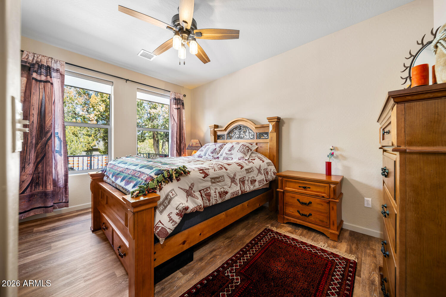 3160 North Eagle Landing Road Show Low, AZ 85901 - Photo 20 of 37 a bed room with a bed and a chandelier