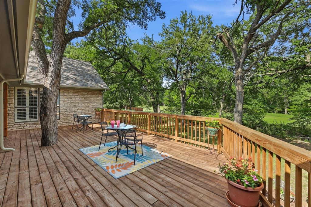 1904 Oak Ridge Trail Bridgeport, TX 76426 - Photo 31 of 40 a view of balcony with wooden floor and outdoor seating