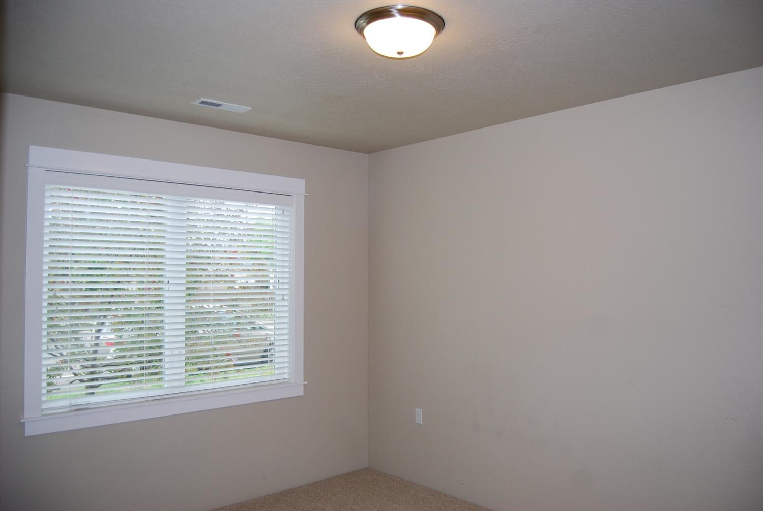 1171 North Haskell Street Central Point, OR 97502 - Photo 15 of 19 a view of an empty room with a window