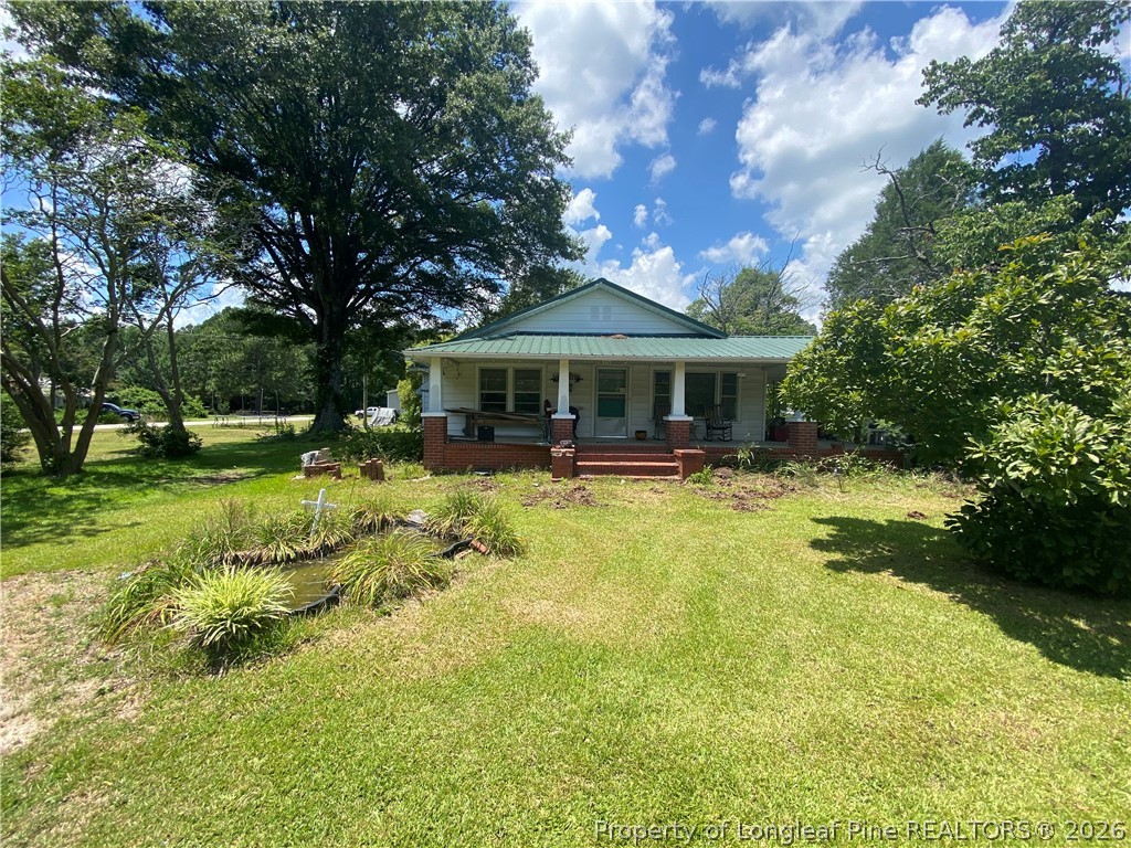 a view of house with a garden