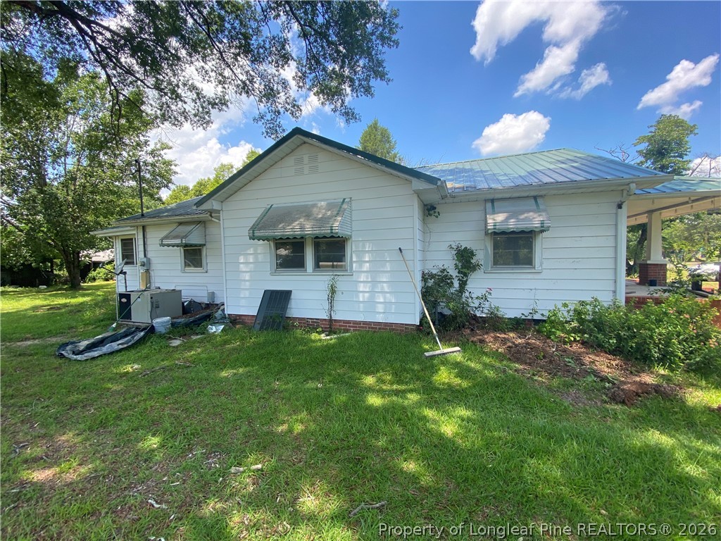 10717 Colliers Chapel Church Road Linden, NC 28356 - Photo 20 of 20 a front view of house with yard and green space