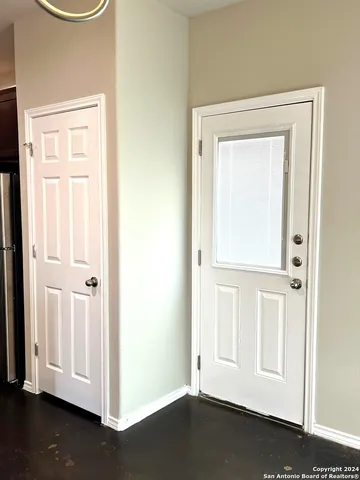 an entryway with wooden floor