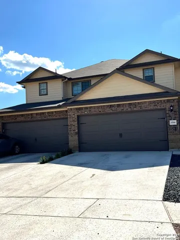 a front view of a house with big yard