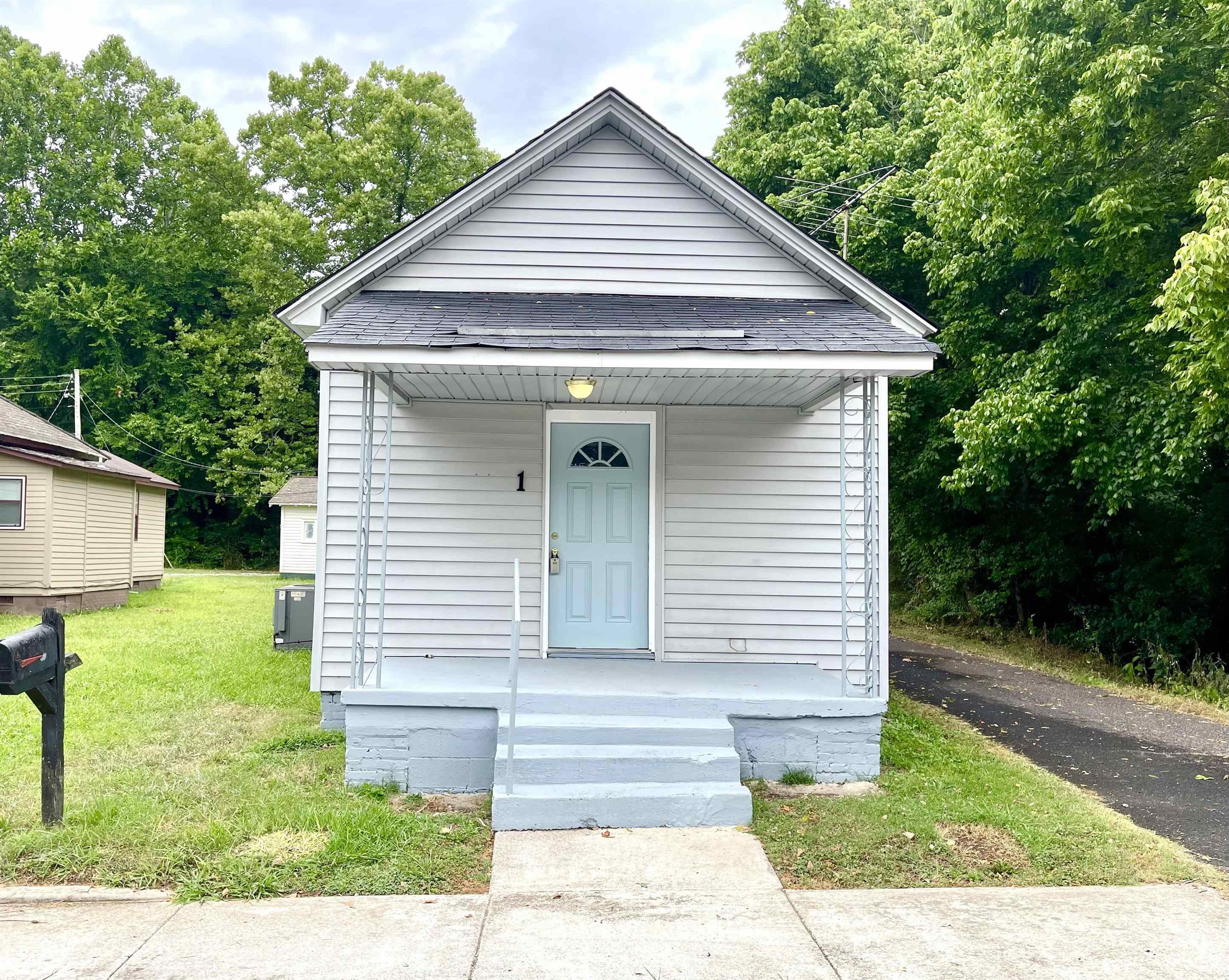 1 Butler Street Jackson, TN 38301 - Photo 1 of 13 a front view of a house with a yard
