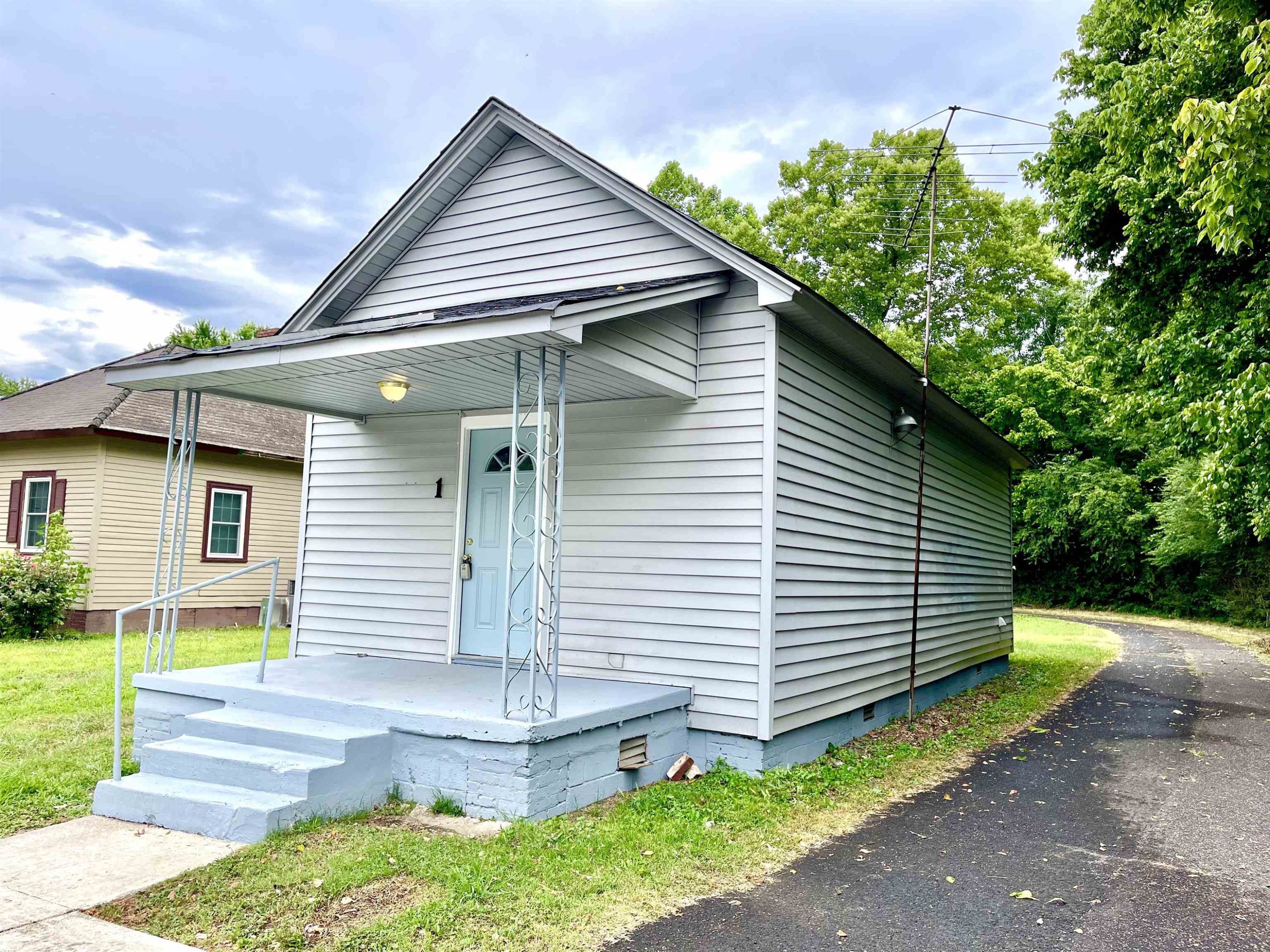 1 Butler Street Jackson, TN 38301 - Photo 2 of 13 a front view of a house with a yard
