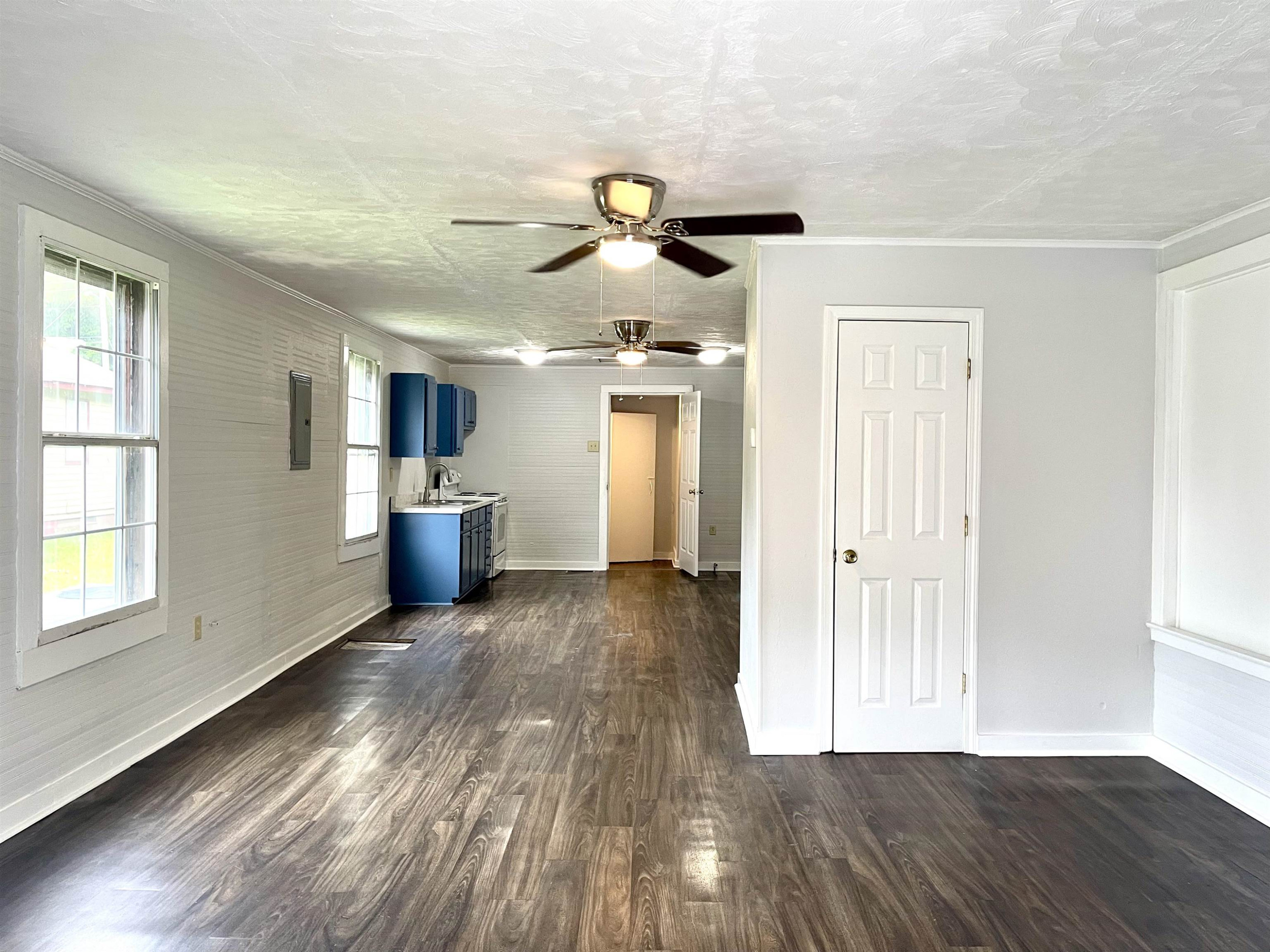 1 Butler Street Jackson, TN 38301 - Photo 3 of 13 a view of empty room with wooden floor and fan