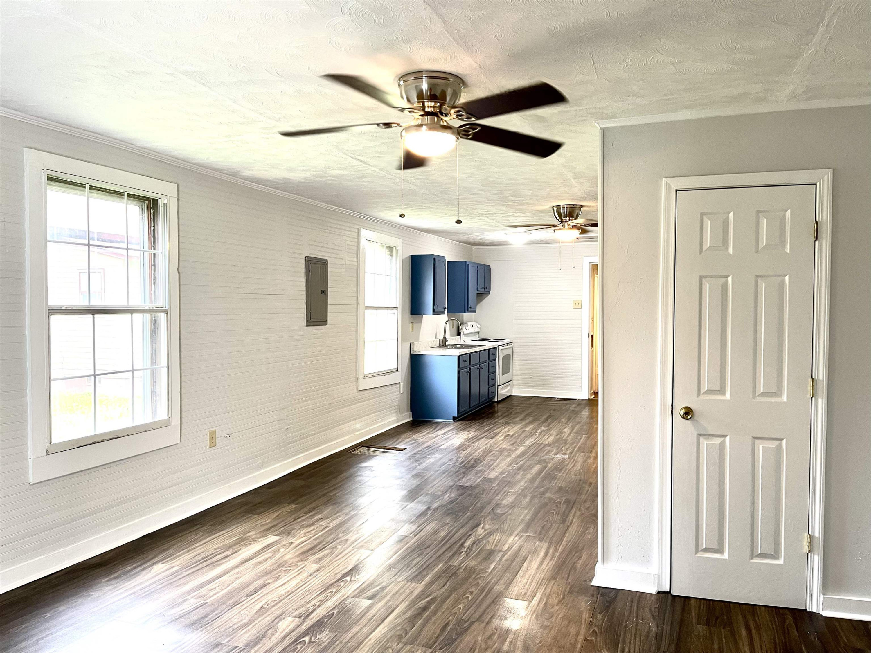 1 Butler Street Jackson, TN 38301 - Photo 4 of 13 a view of a livingroom with a ceiling fan and wooden floor