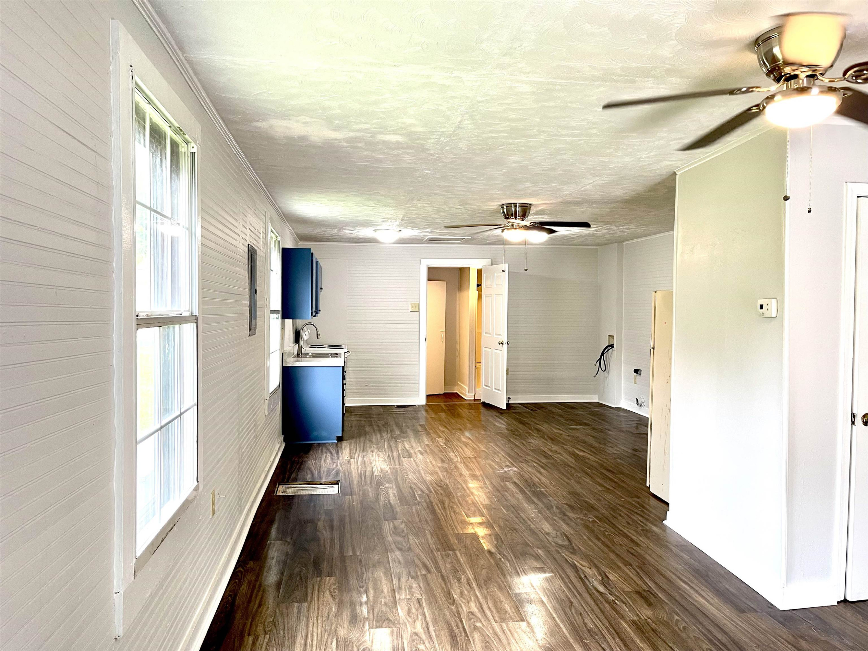 1 Butler Street Jackson, TN 38301 - Photo 5 of 13 a view of a electric room and wooden floor
