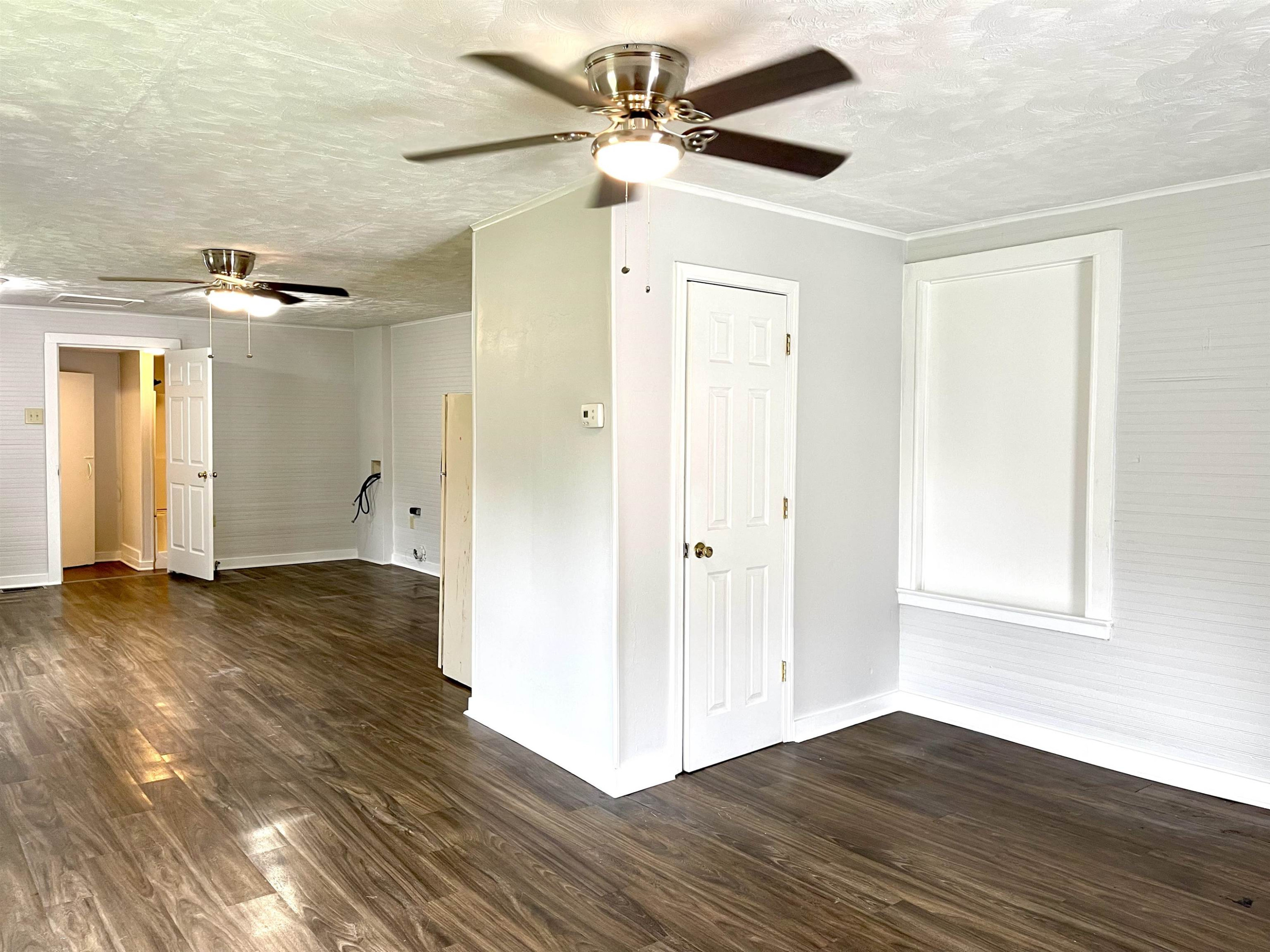 1 Butler Street Jackson, TN 38301 - Photo 6 of 13 a view of a livingroom with a chandelier fan and wooden floor