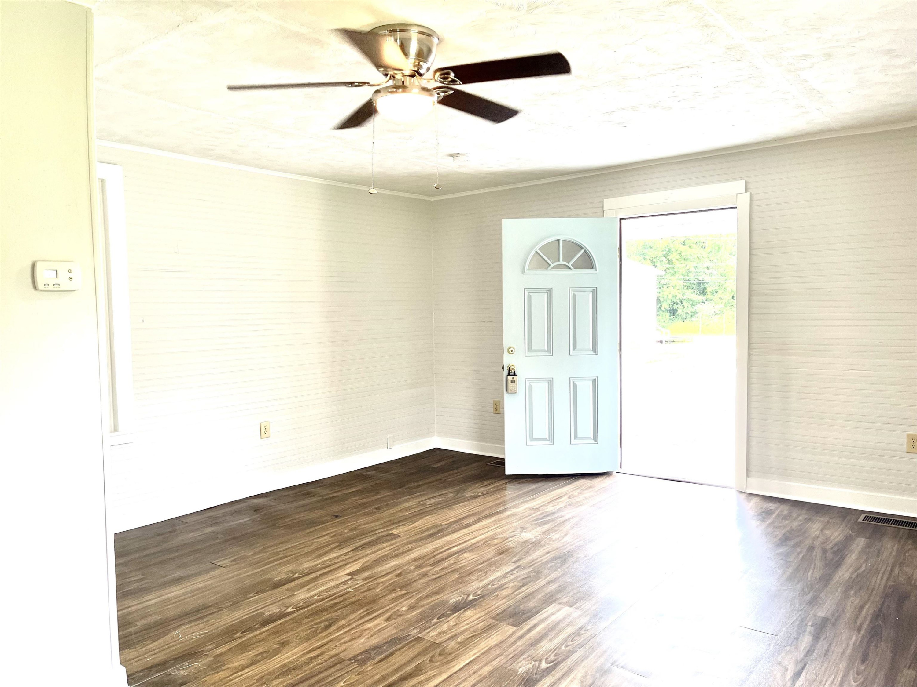 1 Butler Street Jackson, TN 38301 - Photo 7 of 13 a view of an empty room with wooden floor
