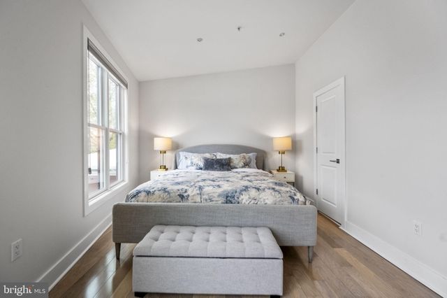 a room with a bed and a window