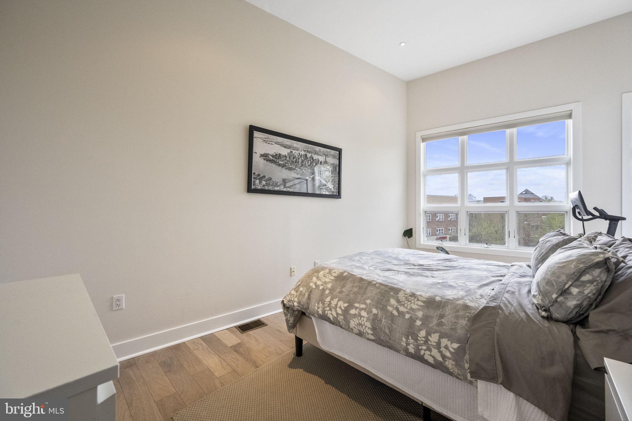 501 Rhode Island Avenue Northwest, Unit 2 Washington, DC 20001 - Photo 17 of 21 a bedroom with a bed and a window