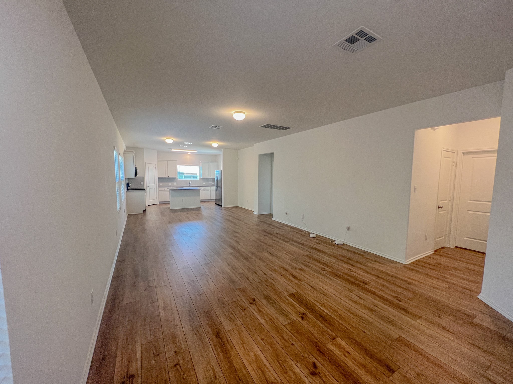 438 Perfect World Loop Jarrell, TX 76537 - Photo 3 of 35 a view of empty room with wooden floor