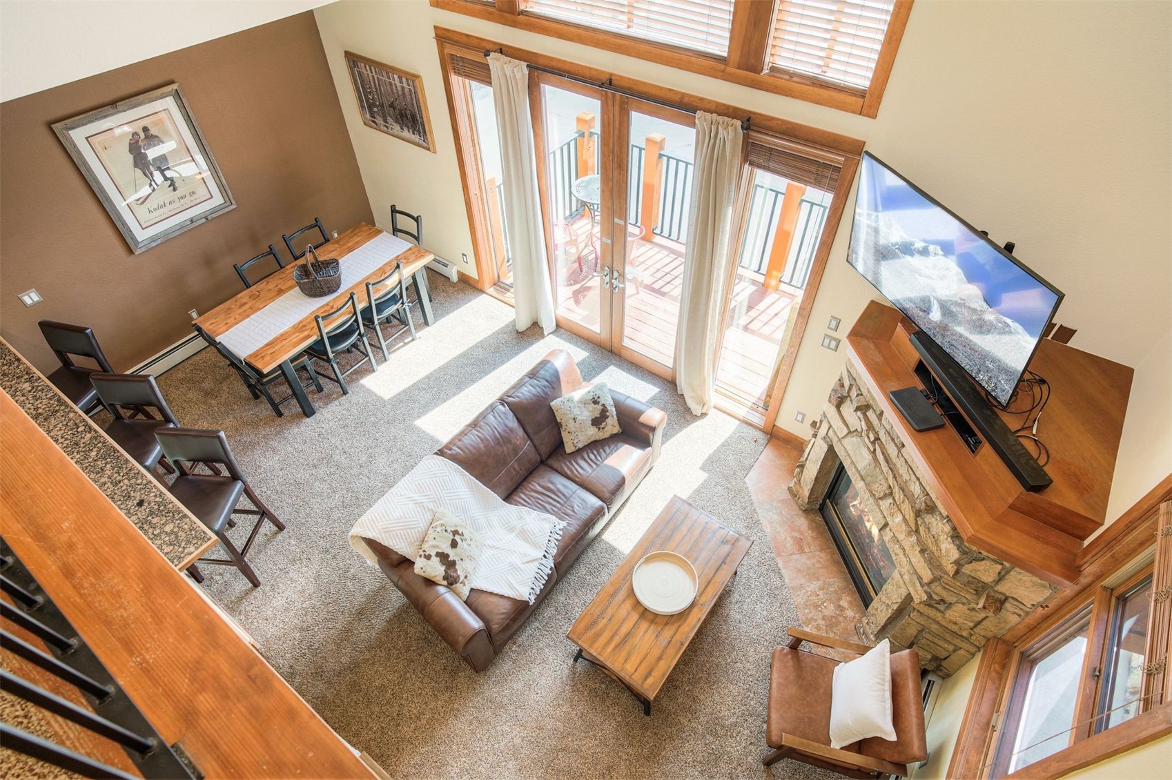 a living room with furniture and a floor to ceiling window