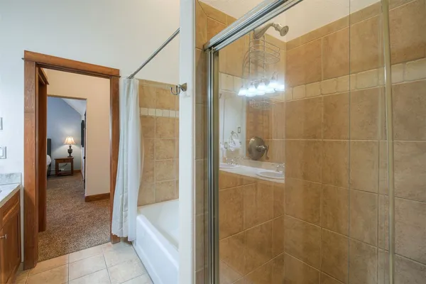 a bathroom with a glass shower door