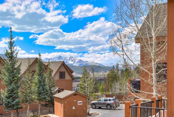 a view of multiple houses with a street