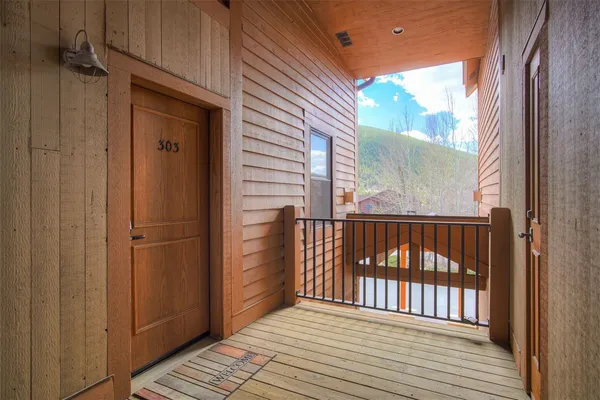 a view of a balcony with wooden floor