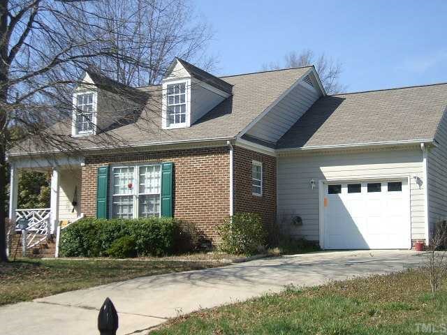 2812 Fernhurst Court Raleigh, NC 27604 - Photo 2 of 4 a front view of a house with yard and green space