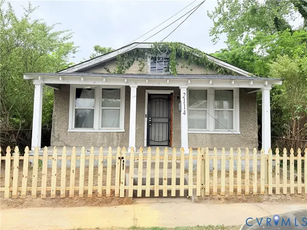 a front view of a house with a small yard