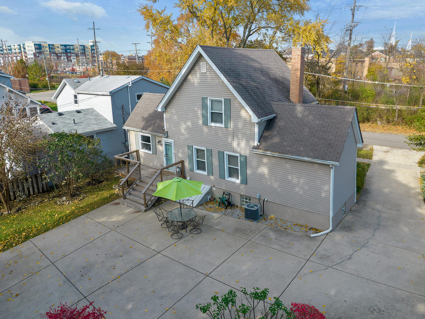 408 Crescent Street Wheaton, IL 60187 - Photo 24 of 36 a view of a white house next to a yard with potted plants