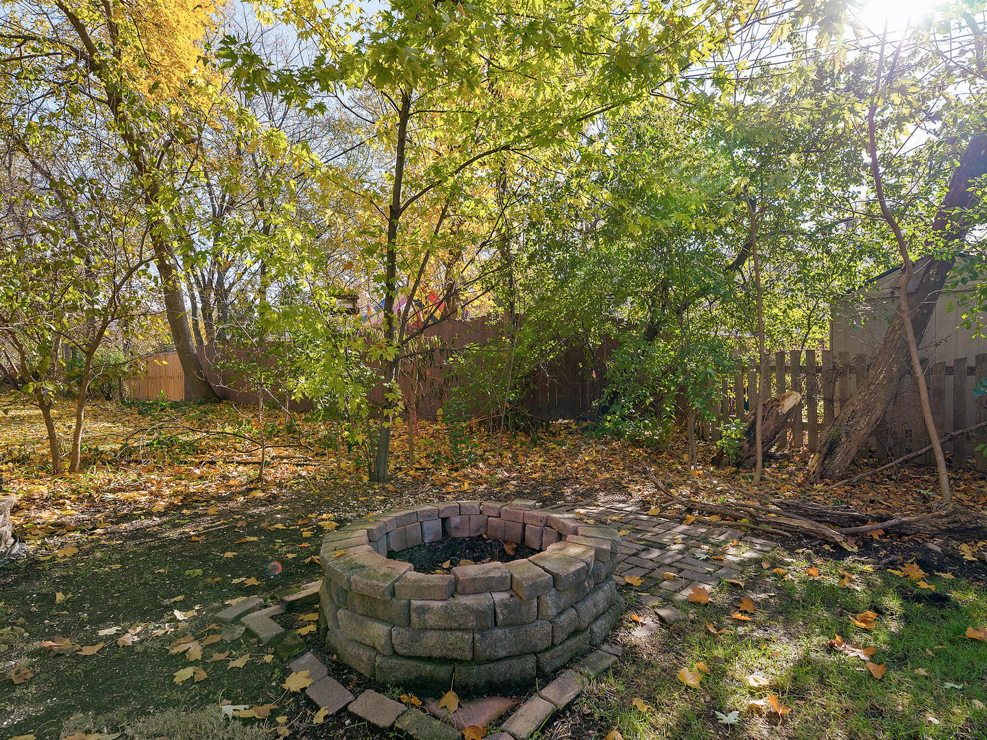 408 Crescent Street Wheaton, IL 60187 - Photo 26 of 36 a patio with fire pit and trees