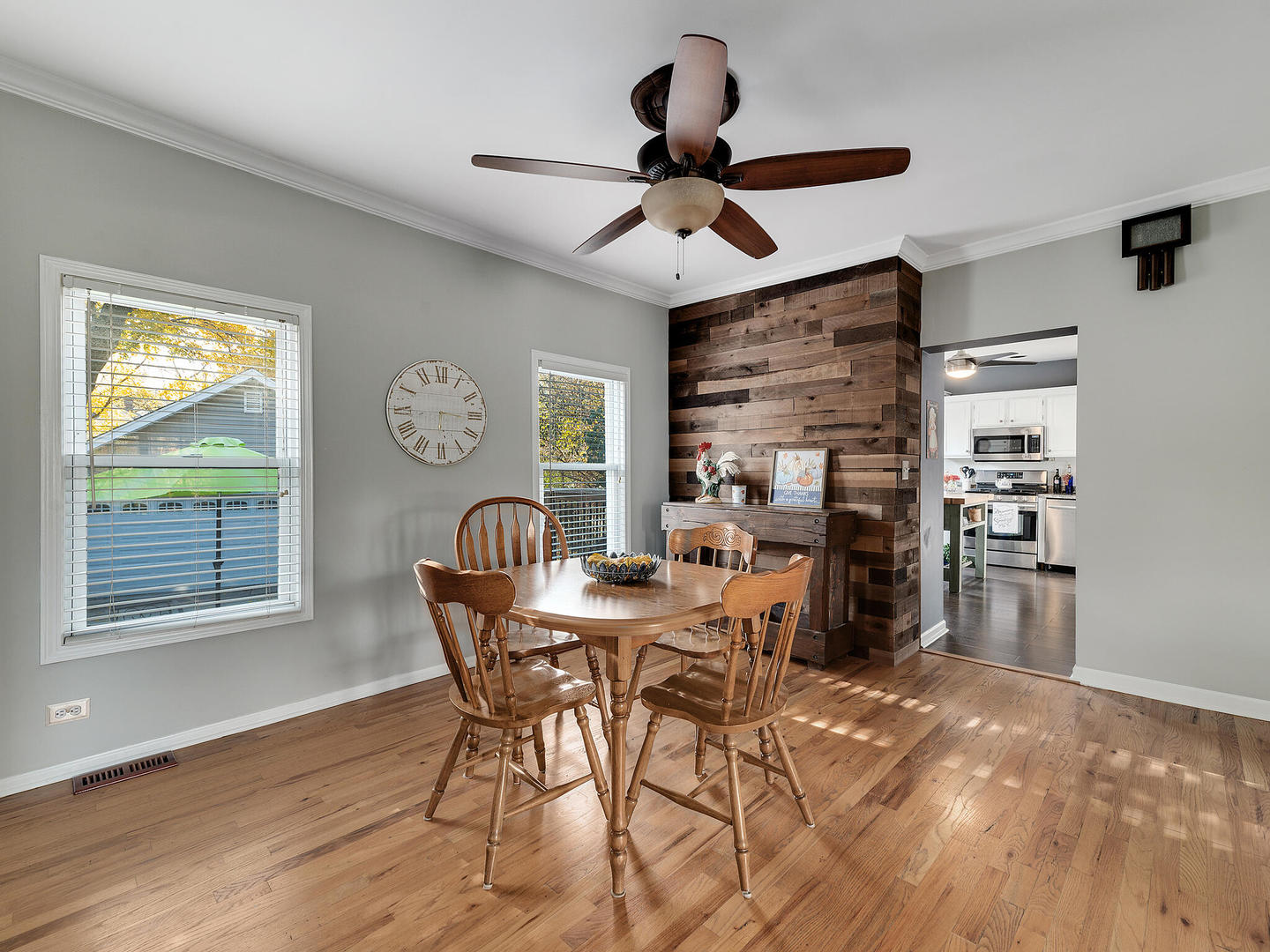 408 Crescent Street Wheaton, IL 60187 - Photo 9 of 36 a view of a dining room with furniture window and wooden floor