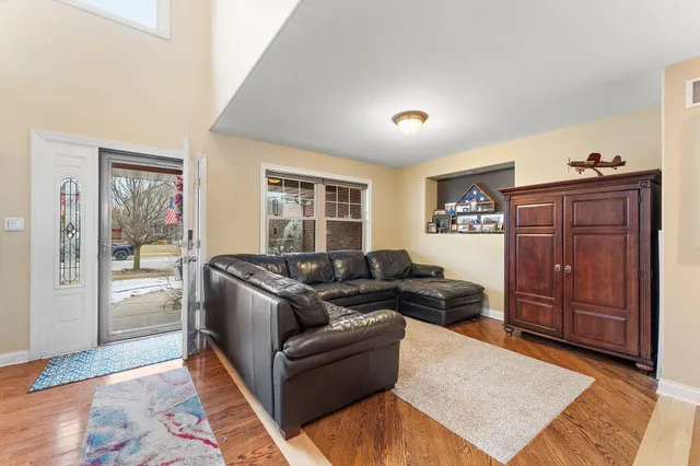 a kitchen with kitchen island a large counter top space and stainless steel appliances