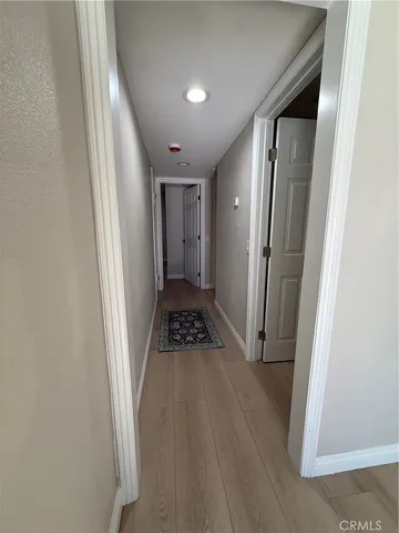a view of an entryway with wooden floor