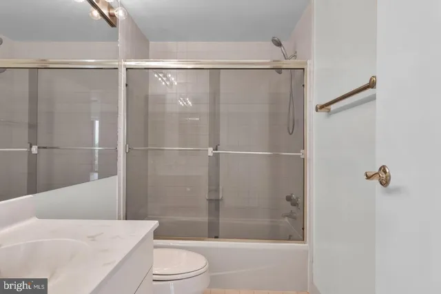 a bathroom with a shower and a toilet