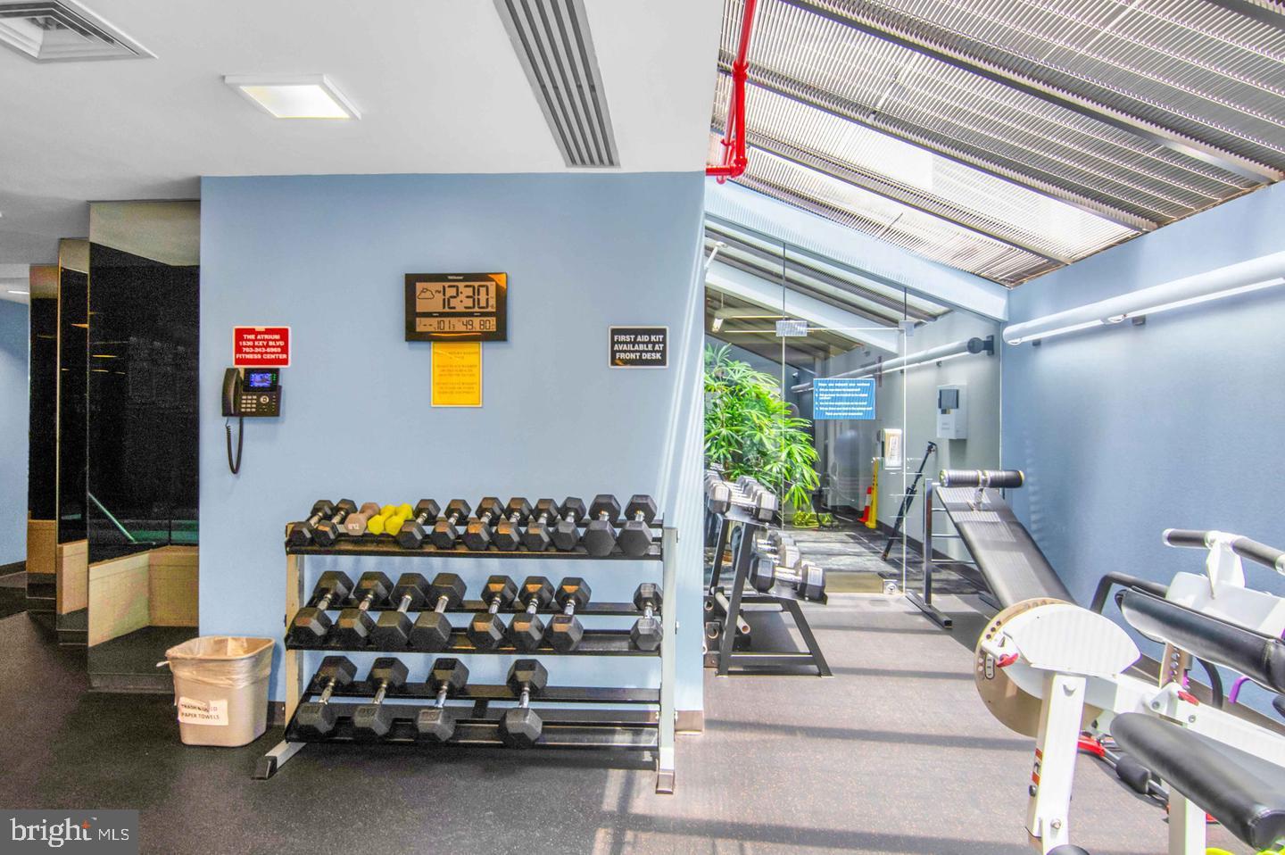 1530 Key Boulevard, Unit 715 Arlington, VA 22209 - Photo 39 of 41 a living room with furniture and a flat screen tv