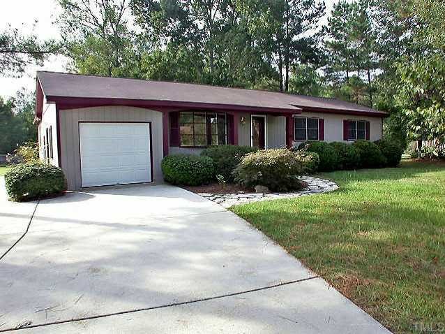 8112 Rhodes Road Apex, NC 27539 - Photo 1 of 1 Lot is 1.24 acres. There are 2 extra parking pads in addition to the rest of the driveway.