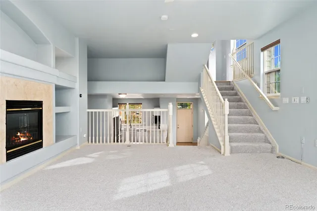 a view of entryway and hall with a front door