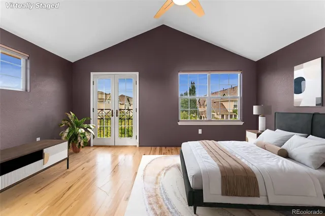 a bedroom with a bed and potted plant