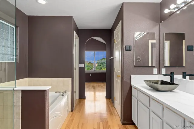 a en suite bathroom with a sink and a mirror