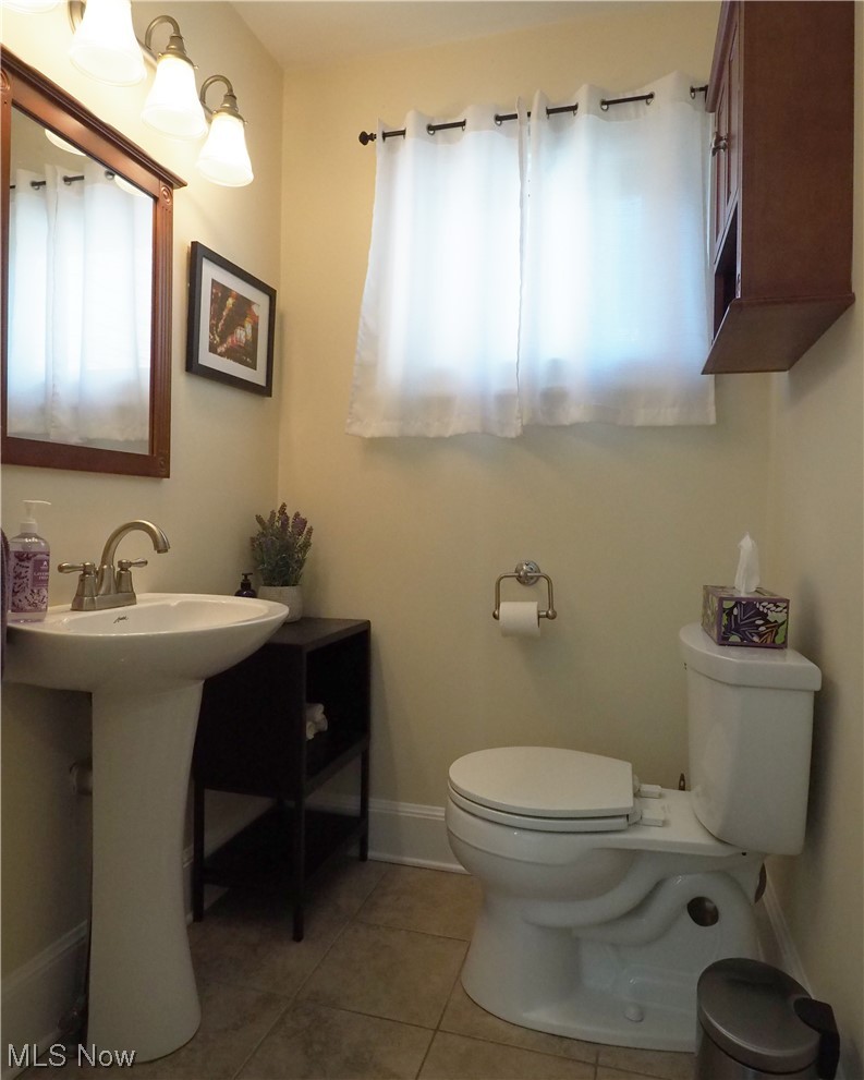 3060 Yorkshire Road Cleveland, OH 44118 - Photo 16 of 35 Bathroom featuring toilet, tile flooring, and sink