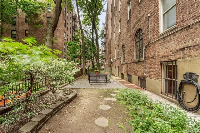 a view of a back yard with patio