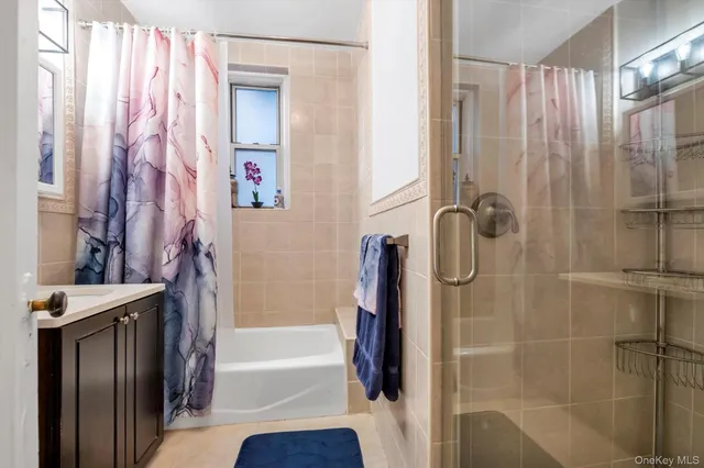 a bathroom with a shower and a tub