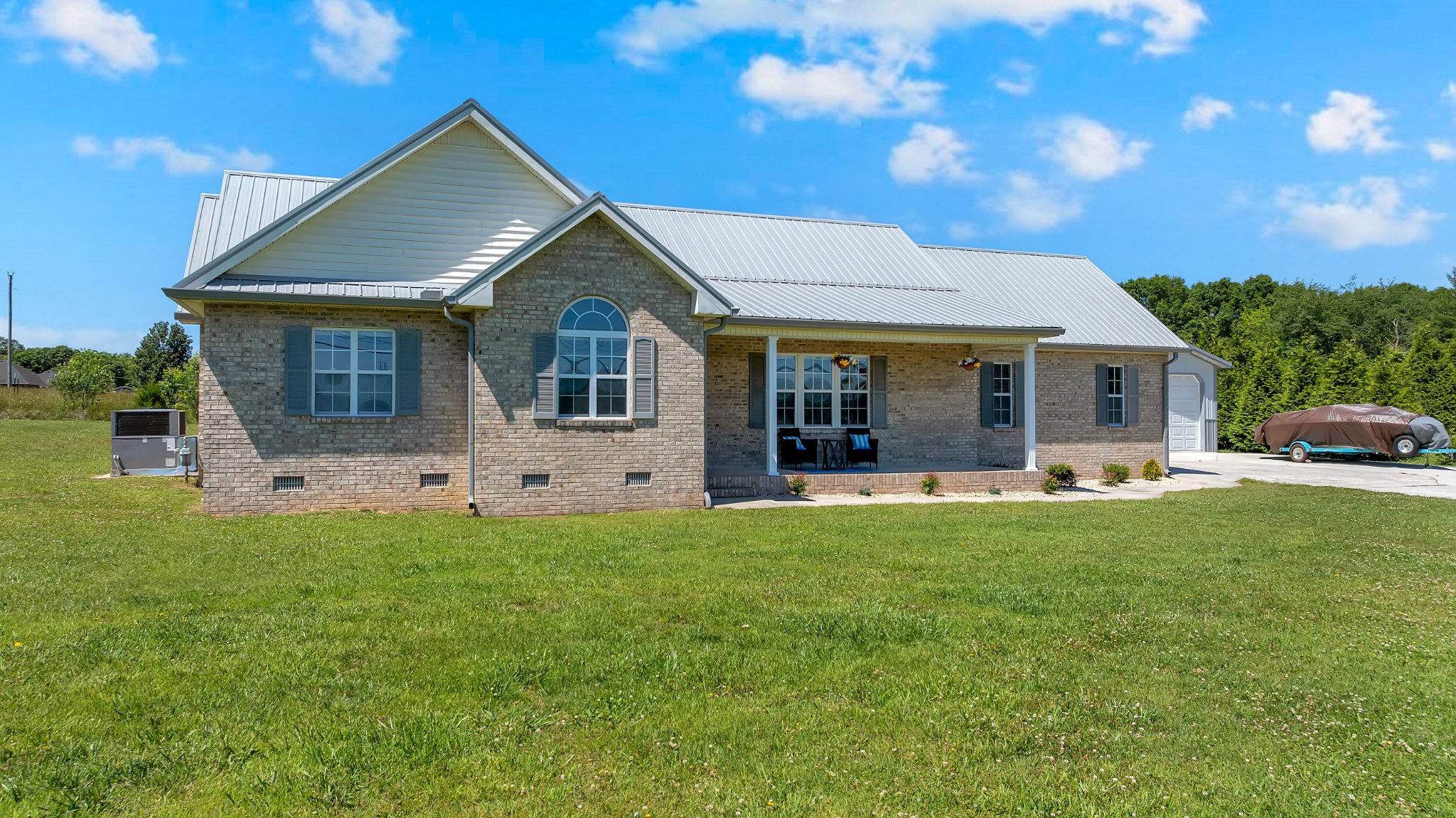 3896 Lynchburg Road Winchester, TN 37398 - Photo 2 of 57 a front view of house with yard barbeque and outdoor seating