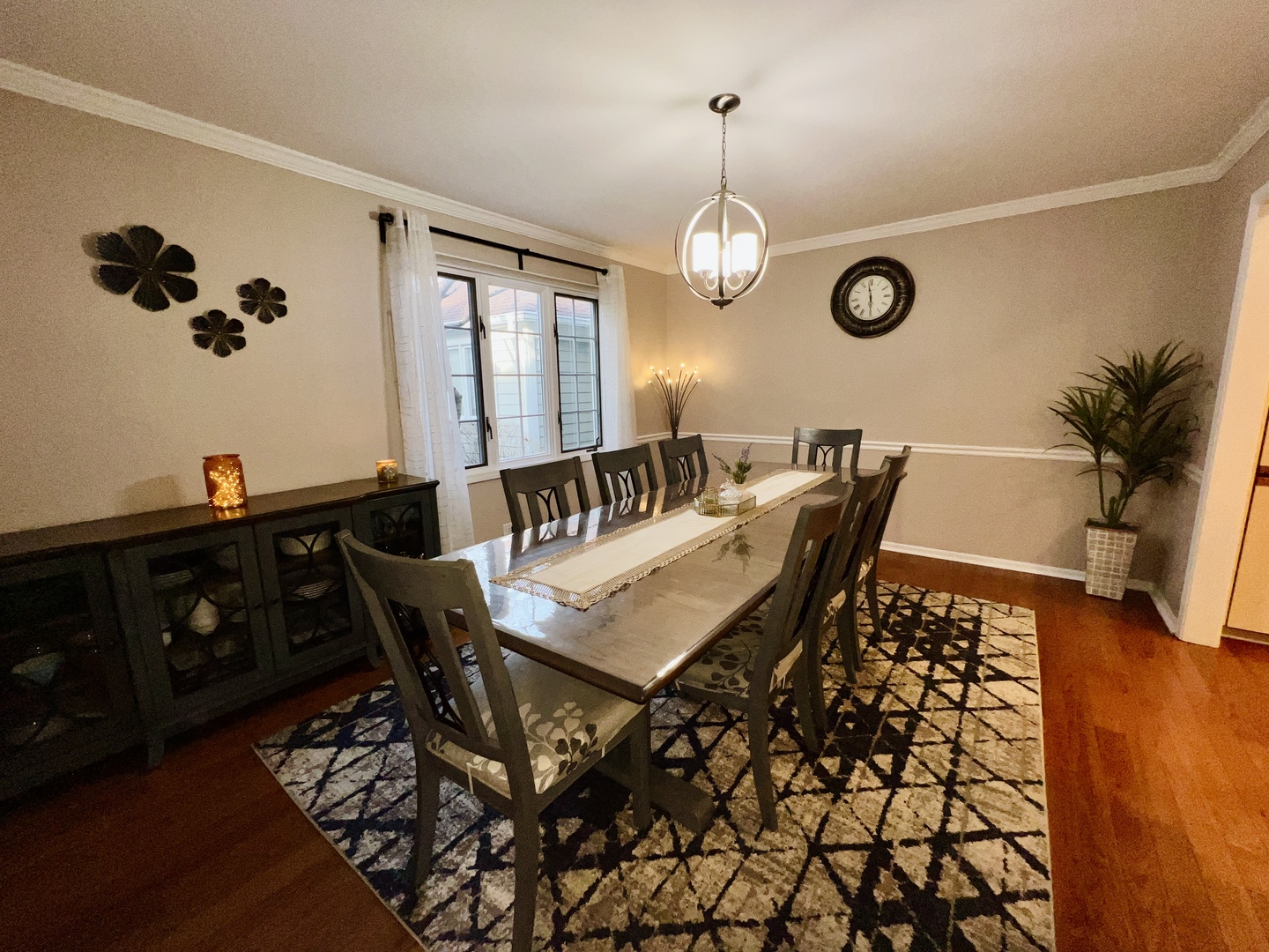 815 Suffield Square Lincolnshire, IL 60069 - Photo 11 of 27 a view of a dining room with furniture and wooden floor