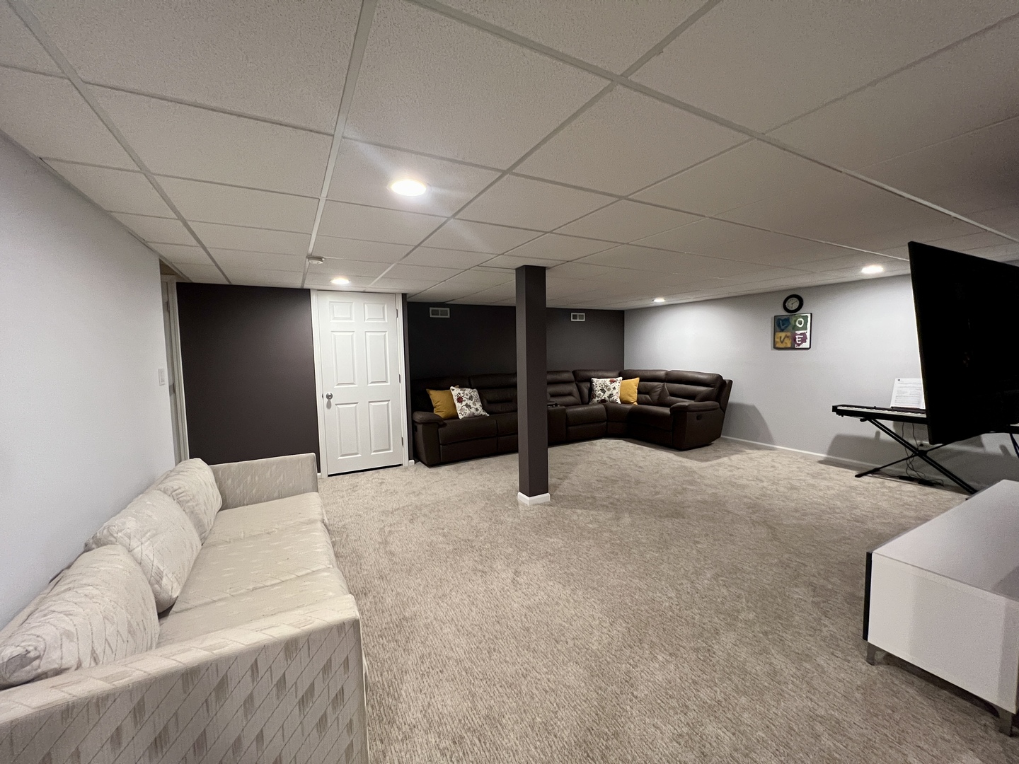 815 Suffield Square Lincolnshire, IL 60069 - Photo 14 of 27 a living room with furniture and a flat screen tv