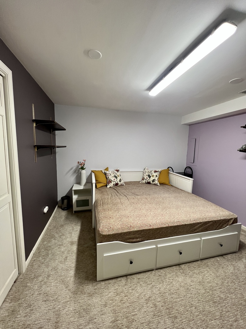 815 Suffield Square Lincolnshire, IL 60069 - Photo 15 of 27 a spacious bedroom with a bed and a dresser in it