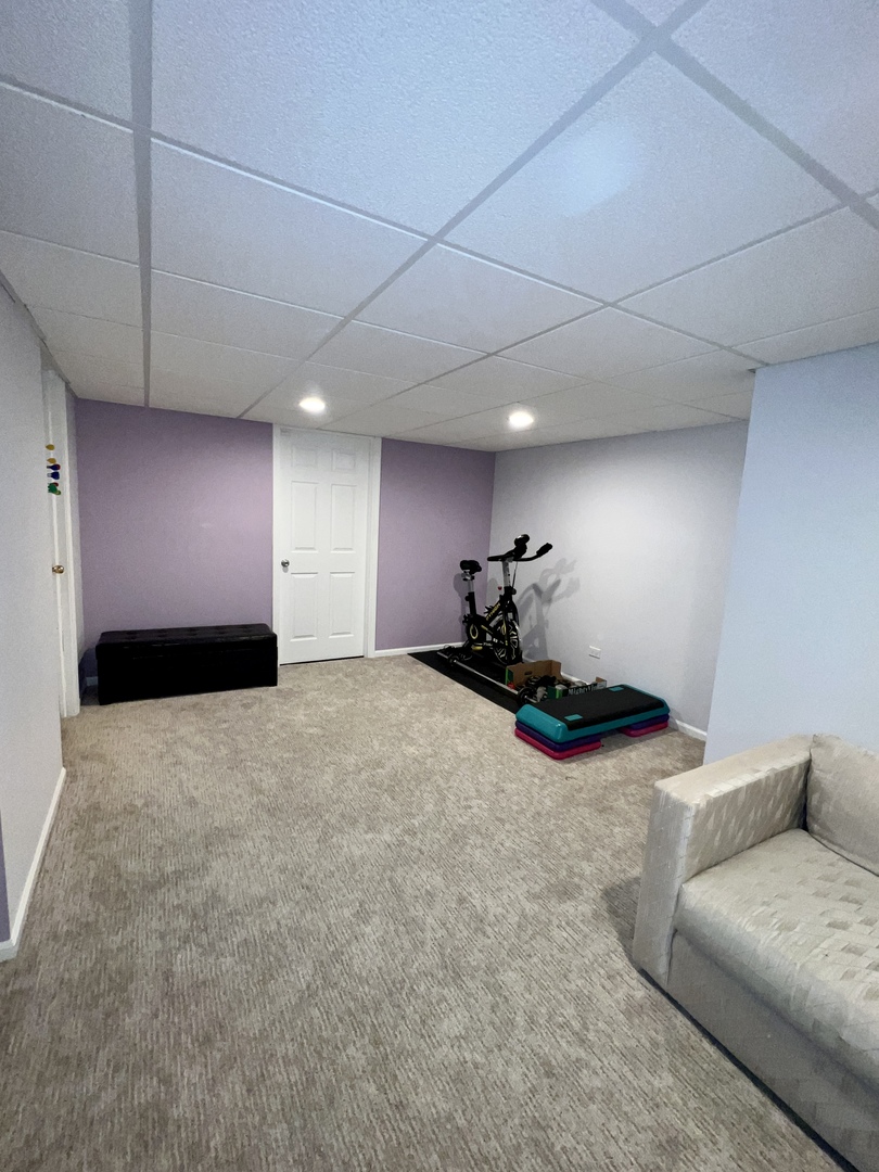 815 Suffield Square Lincolnshire, IL 60069 - Photo 16 of 27 a view of livingroom with furniture and toys