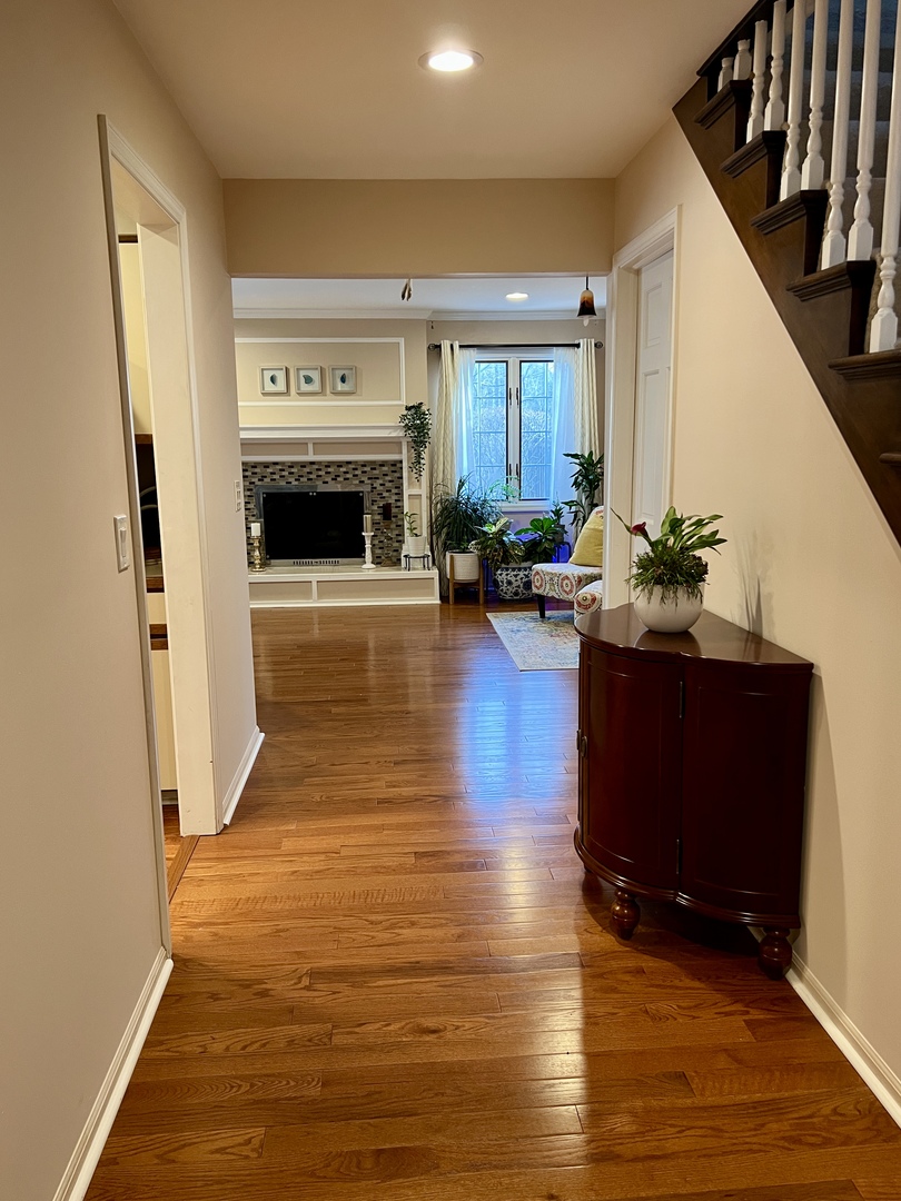 815 Suffield Square Lincolnshire, IL 60069 - Photo 19 of 27 a living room with furniture and a fireplace