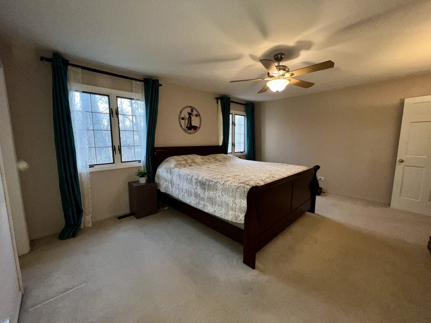 815 Suffield Square Lincolnshire, IL 60069 - Photo 22 of 27 a bedroom with a bed dresser and a window
