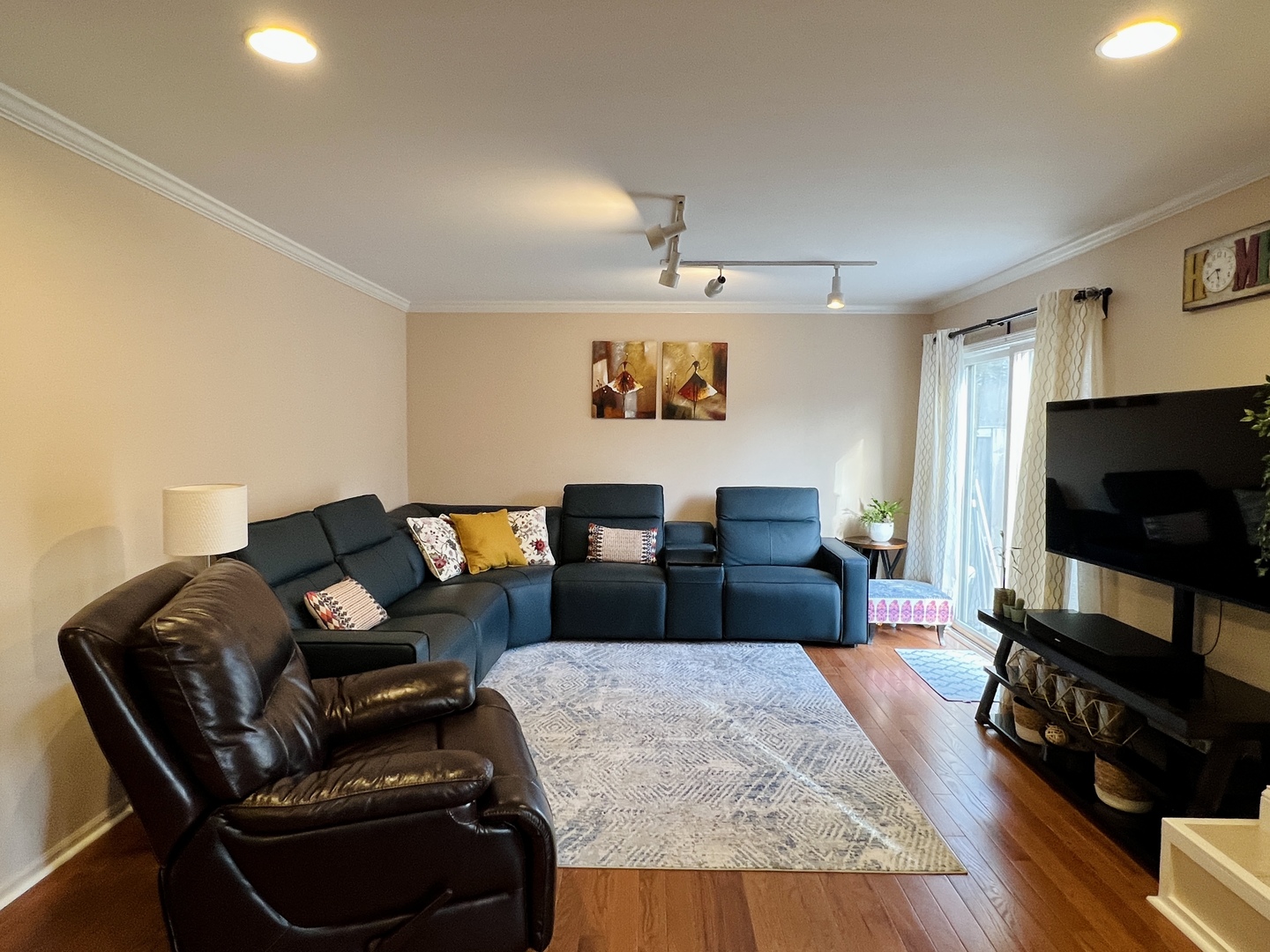 815 Suffield Square Lincolnshire, IL 60069 - Photo 3 of 27 a living room with furniture and a flat screen tv