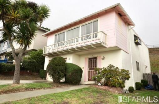 151 Longview Drive Daly City, CA 94015 - Photo 2 of 3 a view of a white house next to a yard and palm trees