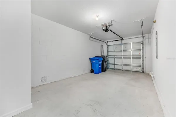 a kitchen with a refrigerator and a sink